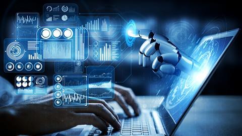 A robot's hand emerges from a laptop screen